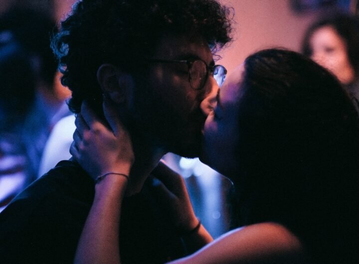 a couple of people that are kissing each other