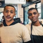 two men standing inside room