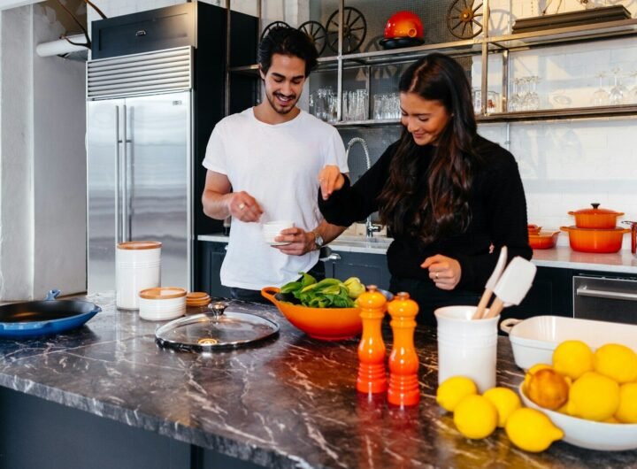 man and woman cooking