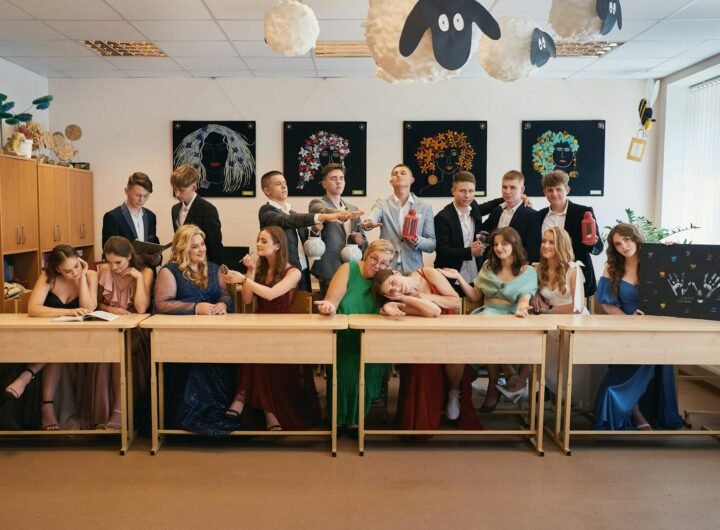 a group of people sitting at a long table