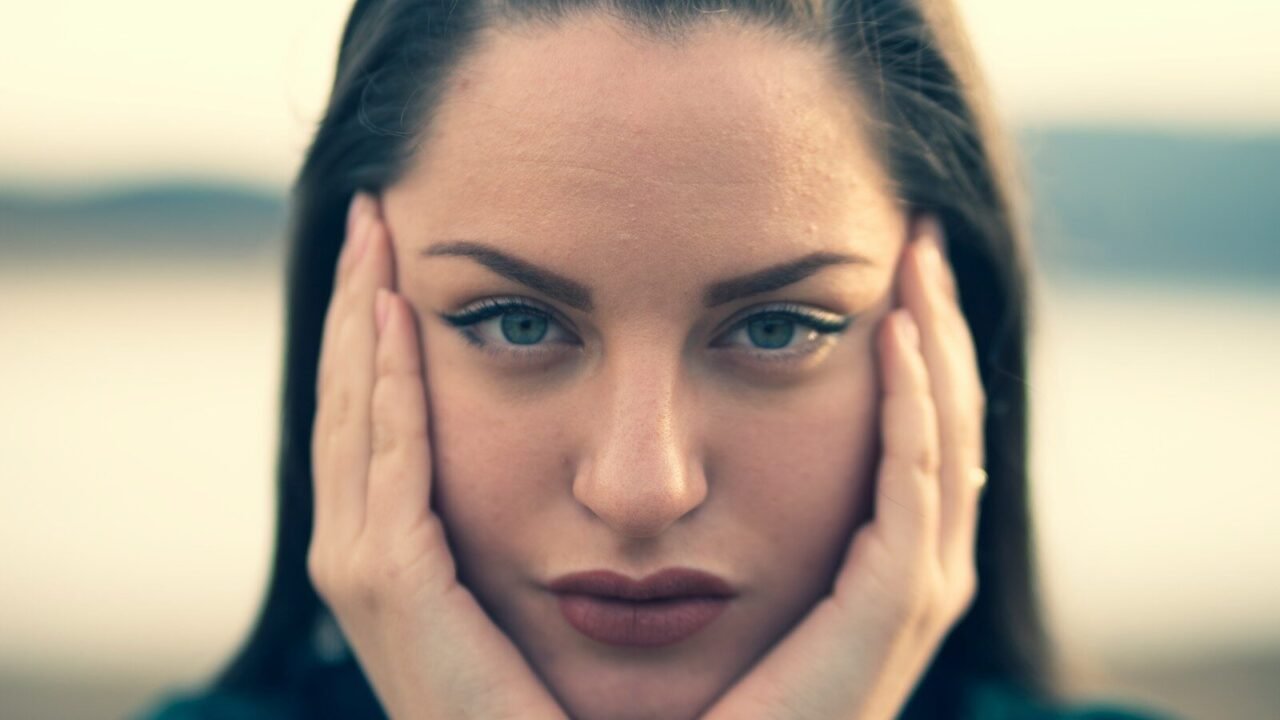 focus photography of woman's face