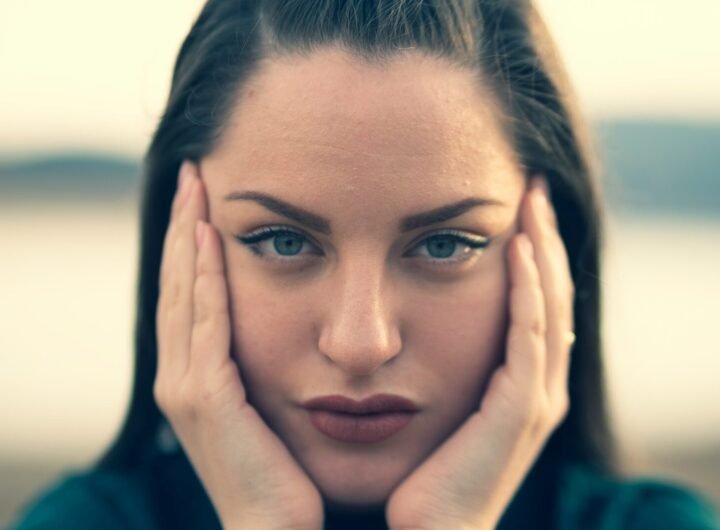 focus photography of woman's face