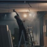 man on white ladder