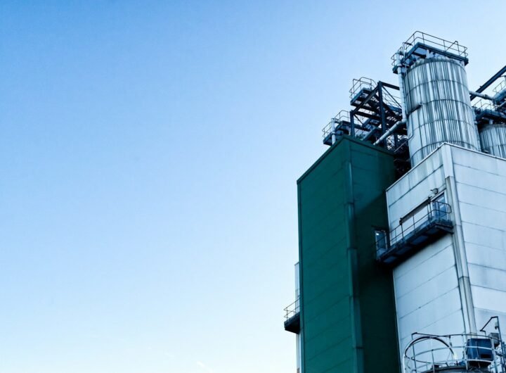 a factory building with a sky background